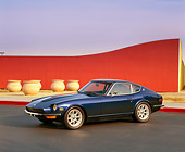AUT 23 RK0687 05
1972 Datsun 240Z Blue 3/4 Side View On Pavement By Wall Filtered