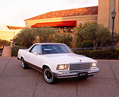 AUT 23 RK0729 03
1978 Chevy SS El Camino White And Gold 3/4 Front View On Pavement By Trees And Building