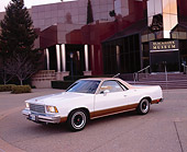AUT 23 RK0731 01
1978 Chevy SS El Camino White And Gold 3/4 Front View On Pavement In Front Of Museum