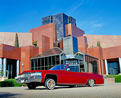 AUT 23 RK0786 01
1977 Cadillac Coupe Deville Convertible Red Low 3/4 Side View On Pavement By Museum