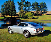 AUT 23 RK0863 01
1971 Datsun 240Z Silver 3/4 Rear View On Grass By Water And Trees