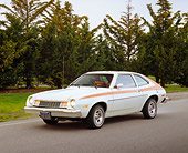 AUT 23 RK0891 01
1978 Ford Pinto White And Orange 3/4 Front View On Pavement By Trees