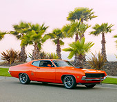 AUT 23 RK1845 01
1971 Ford Torino GT Orange 3/4 Front View On Pavement By Palm Trees