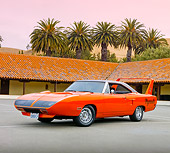 AUT 23 RK1849 01
1970 Plymouth Superbird Orange 3/4 Front View On Pavement By Building