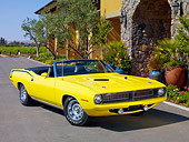 AUT 23 RK1854 01
1970 Plymouth Barracuda 383 Convertible Yellow 3/4 Front View On Pavement By Building