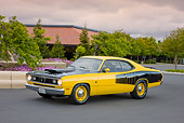 AUT 23 RK1873 01
1970 Plymouth Duster Yellow And Black 3/4 Front View On Pavement By Building