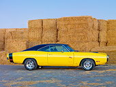 AUT 23 RK1911 01
1970 Dodge Charger R/T Yellow And Black Profile View On Dirt By Straw Bales