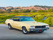 AUT 23 RK1925 01
1970 Buick GS Stage 1 Beige 3/4 Front View On Pavement By Field And Hills