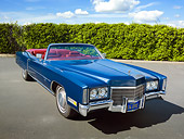 AUT 23 RK1964 01
1971 Cadillac El Dorado Convertible Blue 3/4 Front View On Pavement By Shrubs