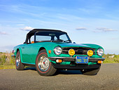 AUT 23 RK1972 01
1975 Triumph TR6 Green 3/4 Front View On Road By Marsh