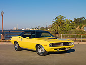 AUT 23 RK2000 01
1970 Plymouth Barracuda 440 Six Pack Yellow 3/4 Front View On Pavement By Water And Palm Trees