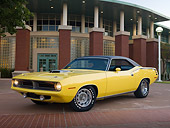 AUT 23 RK2003 01
1970 Plymouth Barracuda 440 Six Pack Yellow 3/4 Front View On Pavement By Building