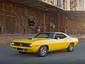 AUT 23 RK2008 01
1970 Plymouth Barracuda 440 Six Pack Yellow 3/4 Front View On Pavement By Old Factory Building