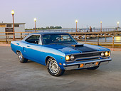 AUT 23 RK2016 01
1970 Plymouth Road Runner Hemi Blue With Black Stripe 3/4 Front View On Pavement By Water