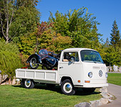 AUT 23 RK2036 01
1970 VW Single Cab White With 1953 Steib LS200 Sidecar Black 3/4 Front View On Grass By Trees