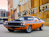 AUT 23 RK2040 01
1970 Dodge Challenger T/A Orange And Black 3/4 Front View On Pavement By Old Building