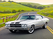 AUT 23 RK2068 01
1970 Chevrolet Chevelle SS Silver And Black 3/4 Front View On Road By Fence And Grassy Hills