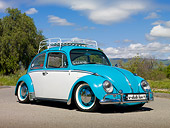 AUT 23 RK2079 01
1970 VW Beetle Sedan Turquoise And White 3/4 Front View On Pavement By Grass And Trees