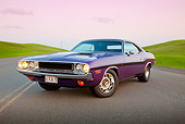 AUT 23 RK2105 01
1970 Dodge Challenger RT 440 Purple 3/4 Front View On Road By Grass