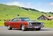 AUT 23 RK2107 01
1970 Plymouth GTX Burnt Orange With Black Stripe 3/4 Front View On Pavement By Barn And Grassy Hills