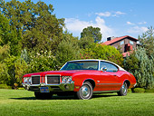 AUT 23 RK2164 01
1971 Oldsmobile Cutlass S Red With White Roof 3/4 Front View On Grass By Trees