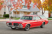 AUT 23 RK2165 01
1971 Oldsmobile Vista Cruiser Red 3/4 Front View On Pavement By House And Autumn Trees