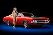 AUT 23 RK2188 01
1970 Ford Torino Red 3/4 Front View In Studio With Swimsuit Model