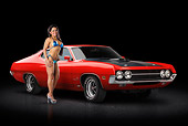 AUT 23 RK3375 01
1970 Ford Torino Red 3/4 Front View On Pavement With Swimsuit Model