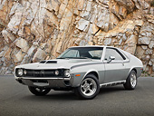 AUT 23 RK3396 01
1970 AMC AMX Silver And Black 3/4 Front View On Pavement By Rocky Cliff