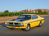 AUT 23 RK3427 01
1971 Dodge Demon Yellow With Black Stripes 3/4 Front View On Pavement By Vineyard