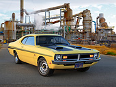 AUT 23 RK3428 01
1971 Dodge Demon Yellow With Black Stripes 3/4 Front View On Pavement By Old Factory