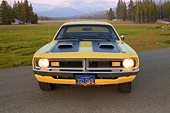 AUT 23 RK3430 01
1971 Dodge Demon Yellow With Black Stripes Front View On Pavement By Field And Mountains