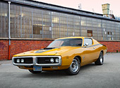 AUT 23 RK3439 01
1971 Dodge Charger 440 Six Pac Butterscotch 3/4 Front View On Pavement By Brick Building