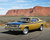 AUT 23 RK3456 01
1971 Plymouth Duster Gold With Black Stripes 3/4 Front View On Pavement In Desert