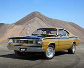 AUT 23 RK3457 01
1971 Plymouth Duster Gold With Black Stripes 3/4 Front View On Pavement By Pile Of Gravel