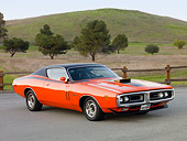 AUT 23 BK0018 01
1971 Dodge Charger 440 Magnum R/T Orange 3/4 Front View On Pavement By Hill