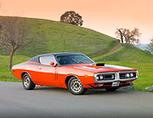 AUT 23 BK0019 01
1971 Dodge Charger 440 Magnum R/T Orange 3/4 Front View On Pavement By Hill
