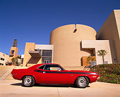 AUT 23 RK0012 02
1971 Dodge RT Challenger 340 Red Profile View On Pavement By Building Blue Sky