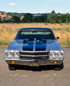 AUT 23 RK0039 02
1970 Chevrolet El Camino SS 454 Silver Black Stripe Head On Shot On Pavement By Tall Grass Blue Sky