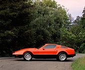 AUT 23 RK0067 04
1975 Orange And Black Bricklin Profile View On Pavement By Trees