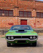 AUT 23 RK0084 04
1971 Green Plymouth Road Runner Head On View On Gravel By Brick Building