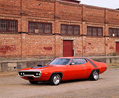 AUT 23 RK0089 03
1972 Hemi Orange Plymouth Road Runner 3/4 Front View On Pavement By Brick Building