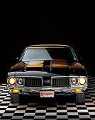 AUT 23 RK0098 03
1970 Oldsmobile 442 W-30 Black And Gold Stripe Head On Shot On Checkered Floor Studio