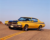 AUT 23 RK0114 02
1970 Buick GSX Yellow And Black 3/4 Front View On Road Blue Sky