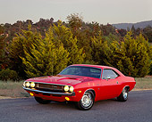 AUT 23 RK0154 02
1970 Dodge Challenger Hemi Orange 3/4 Front View On Pavement By Trees At Dusk