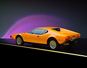 AUT 23 RK0258 01
1973 De Tomaso Pantera Orange 3/4 Rear View On Yellow Line Purple Lighting Studio