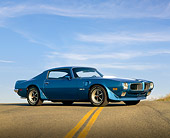 AUT 23 RK0278 01
1970 Pontiac Firebird Trans Am Blue Low 3/4 Side View On Pavement Hill Blue Sky