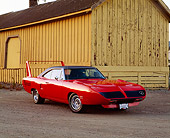 AUT 23 RK0332 02
1970 Plymouth Road Runner Superbird 440 6-Pac Orange Front 3/4 View By Barn