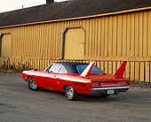 AUT 23 RK0334 02
1970 Plymouth Roadrunner Superbird 440 6-Pac Orange Rear 3/4 View By Barn
