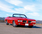 AUT 23 RK0338 02
1970 Pontiac GTO Convertible Red Low 3/4 Front View On Pavement Blue Sky